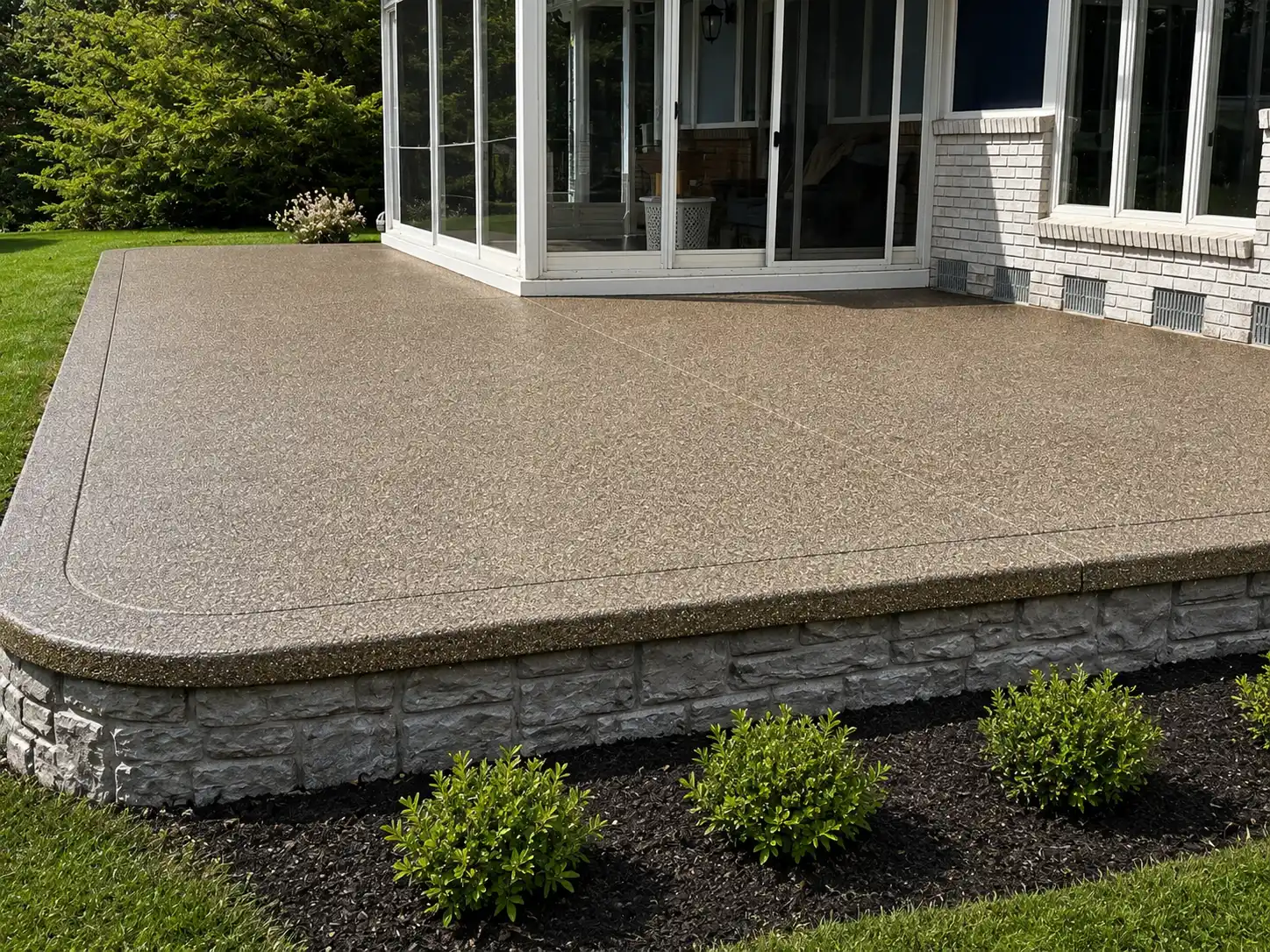 Workers pouring a concrete patio in Michigan